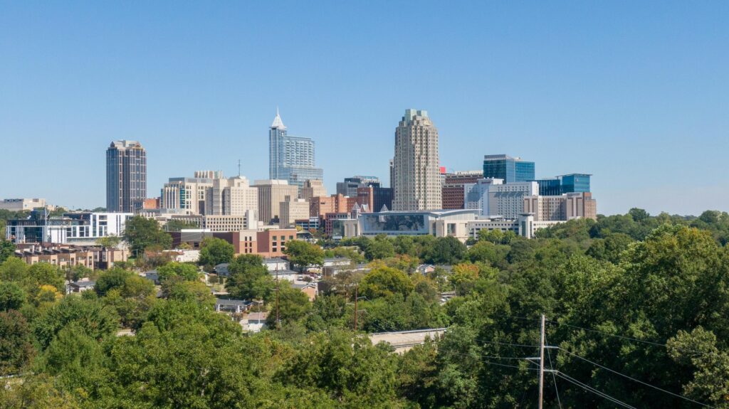 Real estate in Raleigh skyline and residential neighborhoods
